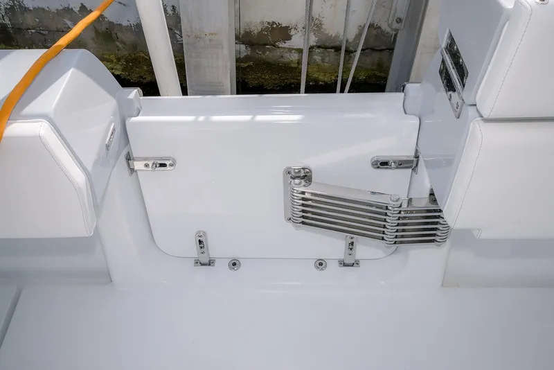 Slide: The Image of 2024 Contender 44 ST boat interior with sleek white seating and stainless steel hardware. - 65