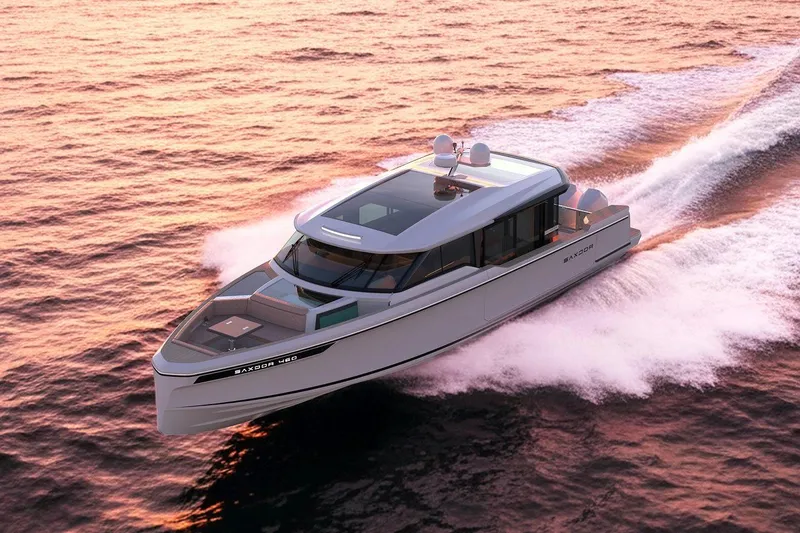 The Image of 2026 Saxdor 460 GTC yacht cruising at sunset on open water. - 0