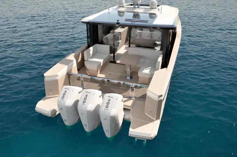 Slide: The Image of 2026 Saxdor 460 GTC luxury boat with triple Mercury 400 engines on open water. - 2