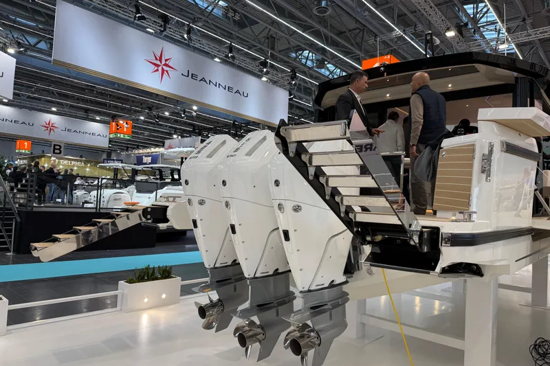 Slide: The Image of 2026 Saxdor 460 GTC boat showcased at a marine exhibition with powerful engines. - 4