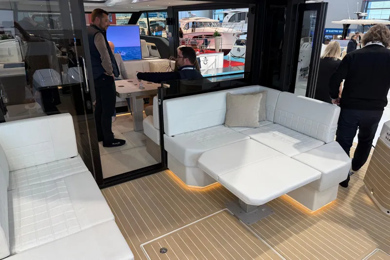 Slide: The Image of Luxurious interior of 2026 Saxdor 460 GTC yacht with modern seating and elegant design. - 6