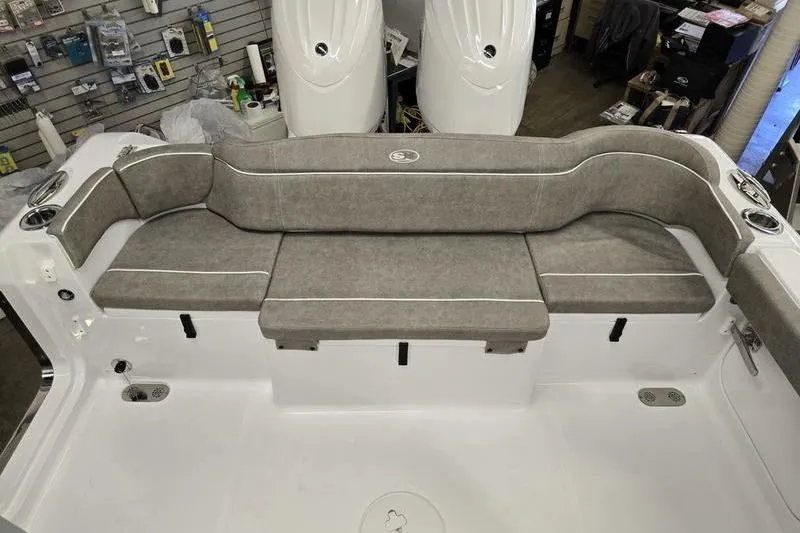 Slide: The Image of 2026 Sea Hunt Ultra 265 SE boat interior with cushioned seating. - 6
