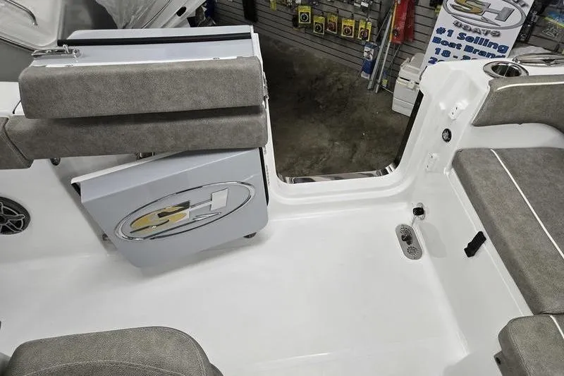 Slide: The Image of Interior view of 2026 Sea Hunt Ultra 265 SE boat with seating and storage. - 8