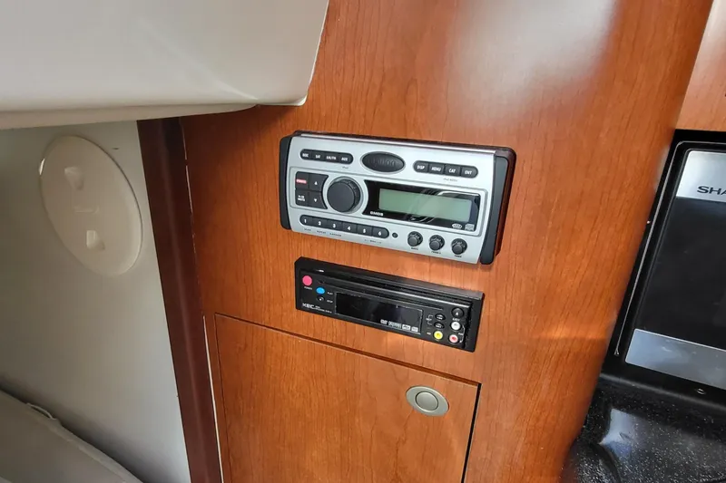Slide: The Image of 2008 Boston Whaler 305 Conquest cabin stereo system and control panel. - 18