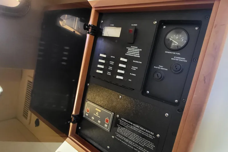 Slide: The Image of Control panel of a 2008 Boston Whaler 305 Conquest boat, featuring fuel gauge and switches. - 19