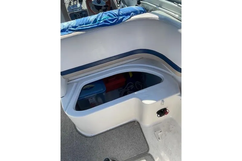 Slide: The Image of 1998 Chaparral 2835 SS boat interior storage compartment with visible equipment. - 23