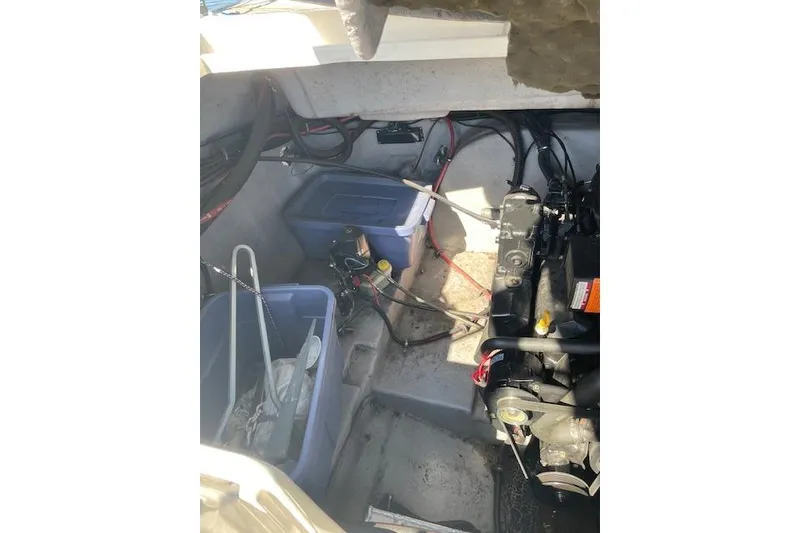 Slide: The Image of Engine compartment of a 1998 Chaparral 2835 SS boat with storage bins and equipment. - 3