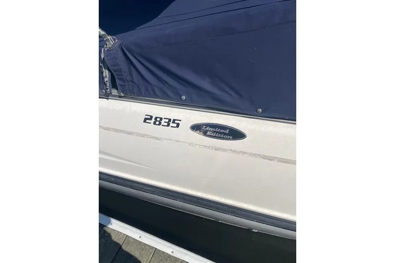 Slide: The Image of 1998 Chaparral 2835 SS Limited Edition boat with blue cover. - 38