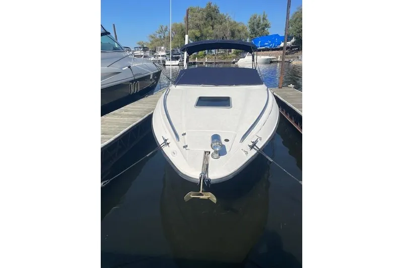 Slide: The Image of 1998 Chaparral 2835 SS boat docked at marina, front view. - 46