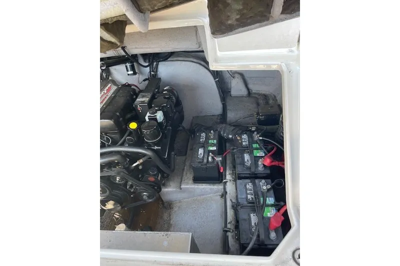 Slide: The Image of 1998 Chaparral 2835 SS engine compartment with visible batteries and mechanical components. - 5