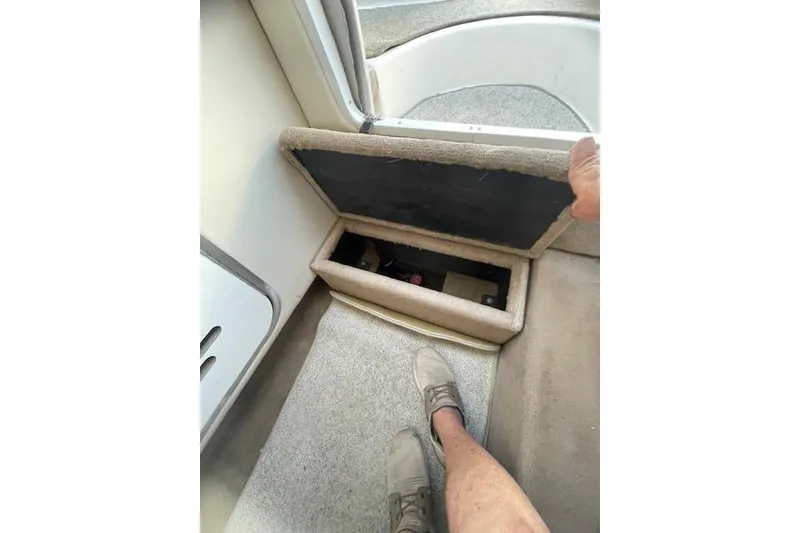 Slide: The Image of 1998 Chaparral 2835 SS boat interior storage compartment with open lid. - 7