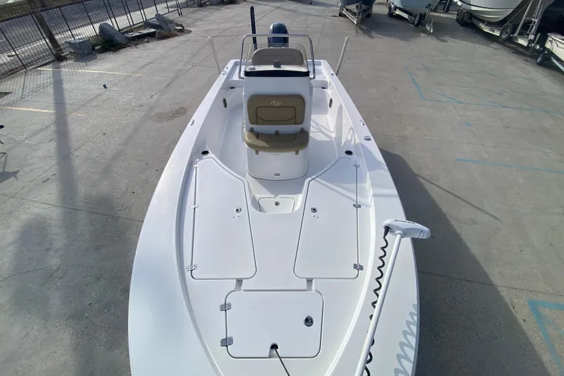 Slide: The Image of 2015 Sportsman Masters 227 Bay Boat on display in a marina setting. - 10