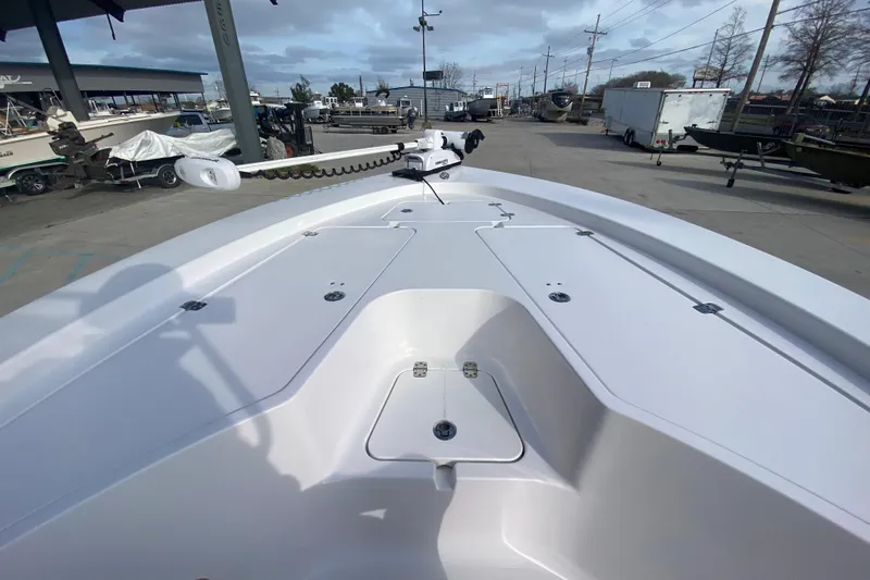 Slide: The Image of 2015 Sportsman Masters 227 Bay Boat deck view at marina, showcasing spacious layout. - 11