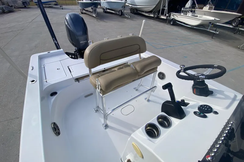 Slide: The Image of 2015 Sportsman Masters 227 Bay Boat interior with steering console and seating. - 15