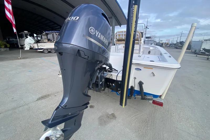 Slide: The Image of 2015 Sportsman Masters 227 Bay Boat with Yamaha outboard motor, docked outdoors. - 20