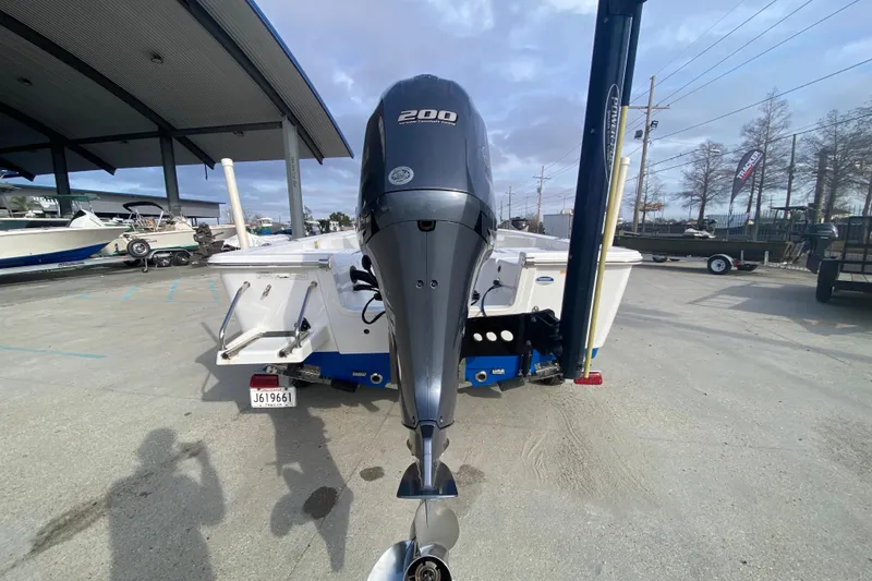 Slide: The Image of 2015 Sportsman Masters 227 Bay Boat with 200 HP engine at a marina. - 3