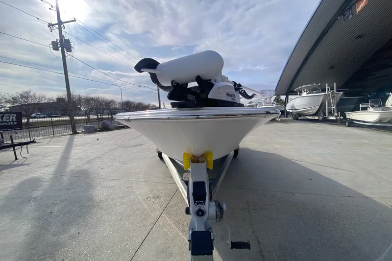 Slide: The Image of 2015 Sportsman Masters 227 Bay Boat on trailer, parked outdoors under cloudy sky. - 7