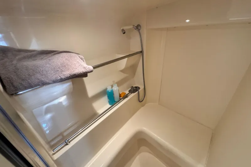Slide: The Image of Shower area in 1997 Carver 350 Mariner yacht with towel and toiletries. - 14
