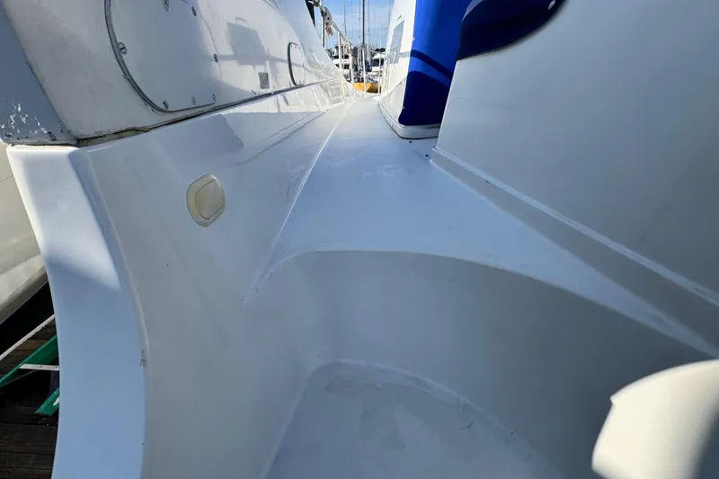 Slide: The Image of 1997 Carver 350 Mariner boat deck, showcasing sleek white surface and design details. - 15