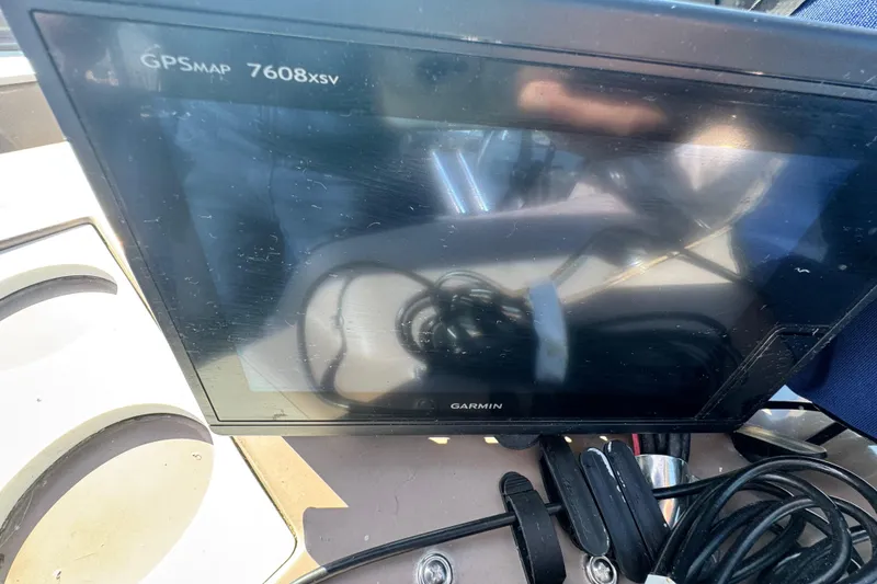 Slide: The Image of Garmin GPSMAP 7608xsv on 1997 Carver 350 Mariner dashboard, with cables visible. - 24