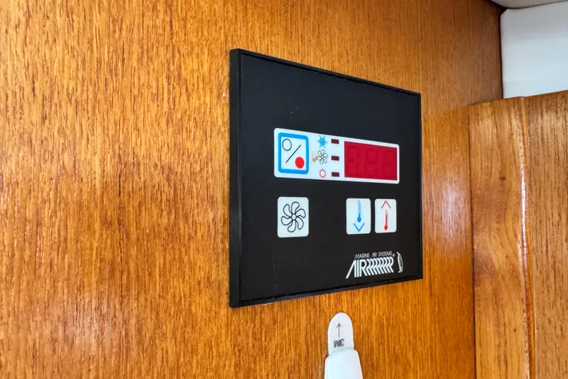Slide: The Image of Control panel on 1997 Carver 350 Mariner boat, featuring marine air systems. - 27
