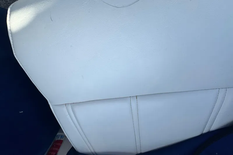 Slide: The Image of White leather seat on a 1997 Carver 350 Mariner boat. - 31