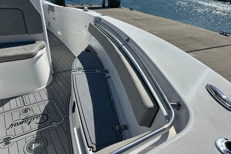 Slide: The Image of 2022 Sea Pro 259 Center Console boat interior with cushioned seating and sleek design. - 25