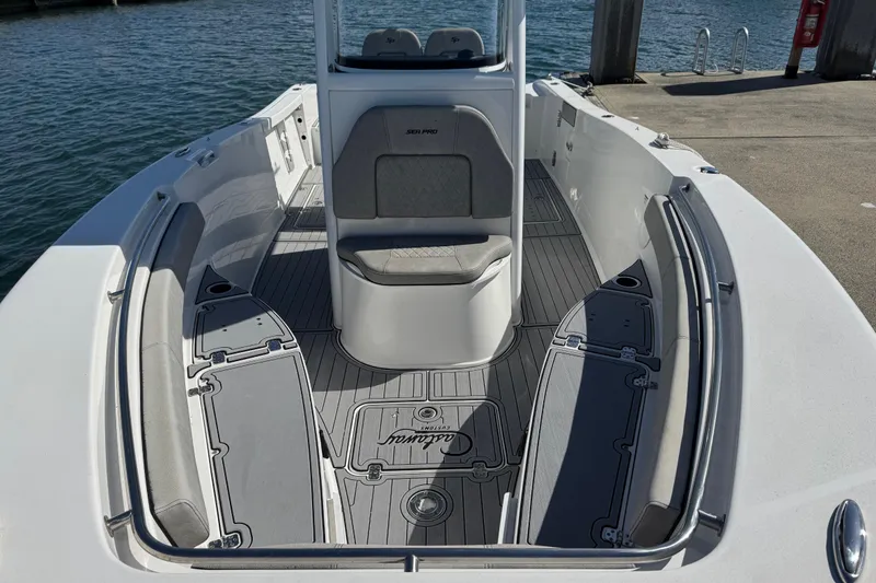 Slide: The Image of 2022 Sea Pro 259 Center Console boat interior with sleek seating and modern design. - 26