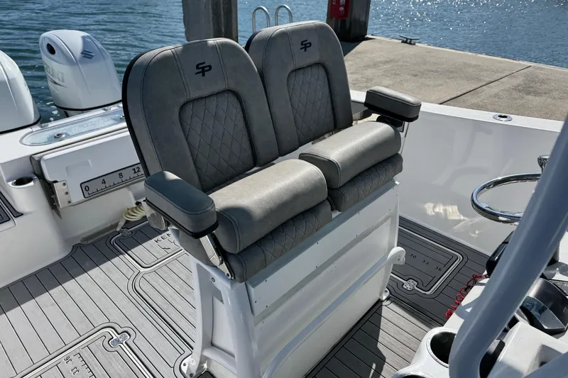 Slide: The Image of 2022 Sea Pro 259 Center Console boat with dual seats and modern design. - 29