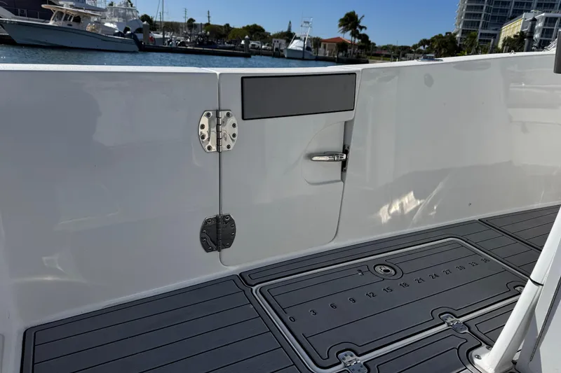 Slide: The Image of 2022 Sea Pro 259 Center Console boat deck with hatch and sleek design. - 31