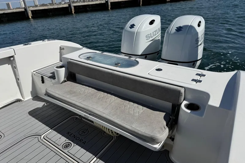 Slide: The Image of 2022 Sea Pro 259 Center Console boat with dual Suzuki engines, featuring a comfortable rear bench seat. - 34