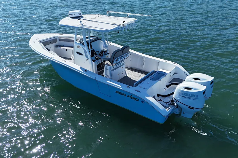Slide: The Image of 2022 Sea Pro 259 Center Console boat on water, featuring dual Suzuki engines. - 4