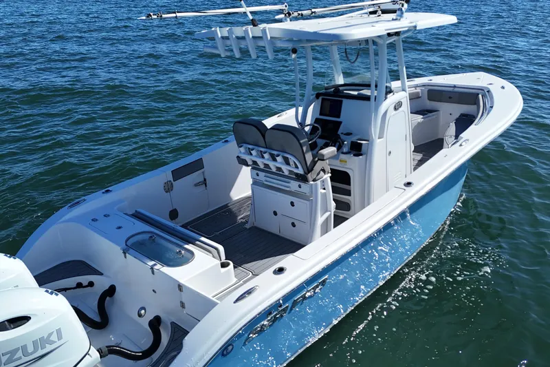 Slide: The Image of 2022 Sea Pro 259 Center Console boat on water, featuring sleek design and modern amenities. - 5