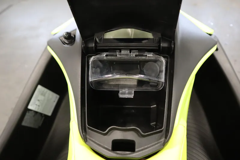 Slide: The Image of 2024 Sea-Doo Spark Trixx 3up storage compartment, open with visible interior. - 15