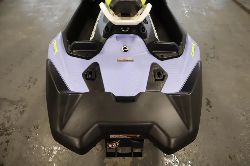 Slide: The Image of 2024 Sea-Doo Spark Trixx 3up, rear view on wet concrete floor. - 19
