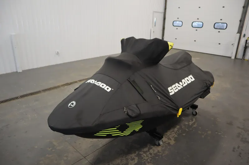 Slide: The Image of 2024 Sea-Doo Spark Trixx 3up covered in a garage setting. - 21