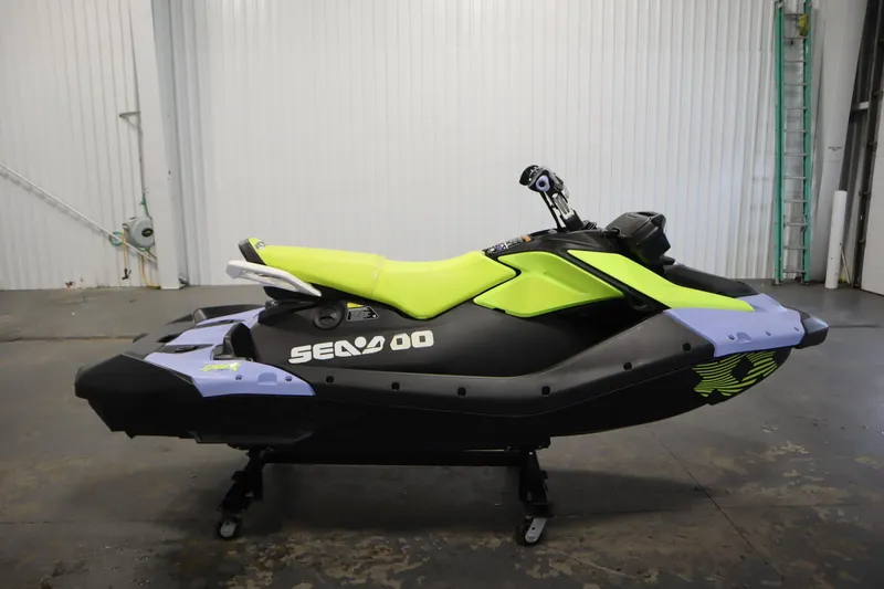 Slide: The Image of 2024 Sea-Doo Spark Trixx 3up jet ski in vibrant lime and black colors. - 4