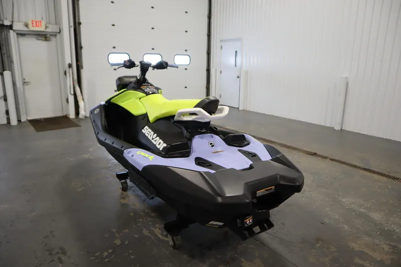 Slide: The Image of 2024 Sea-Doo Spark Trixx 3up in a garage, showcasing vibrant design and features. - 7