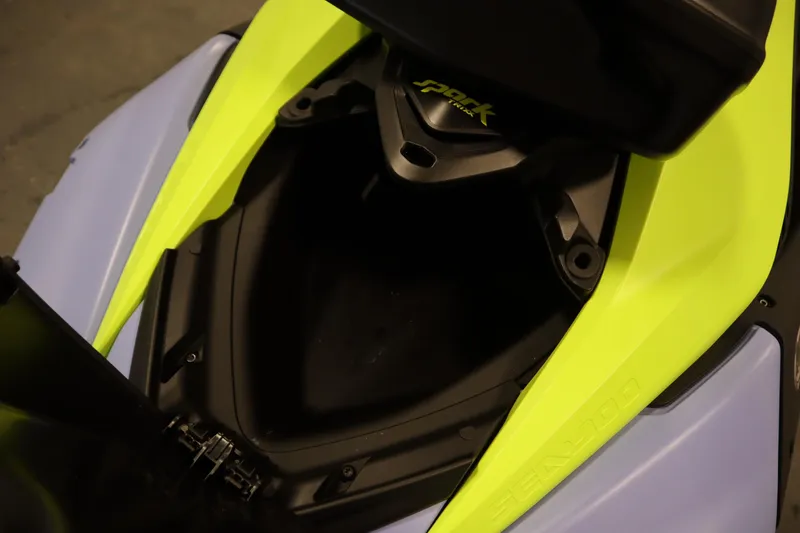 Slide: The Image of 2024 Sea-Doo Spark Trixx 3up storage compartment, featuring vibrant yellow and black design. - 9