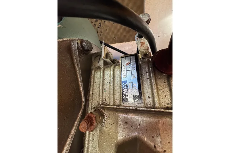 Slide: The Image of Close-up of a 2006 Lagoon 380 engine component with visible Volvo Penta label. - 23