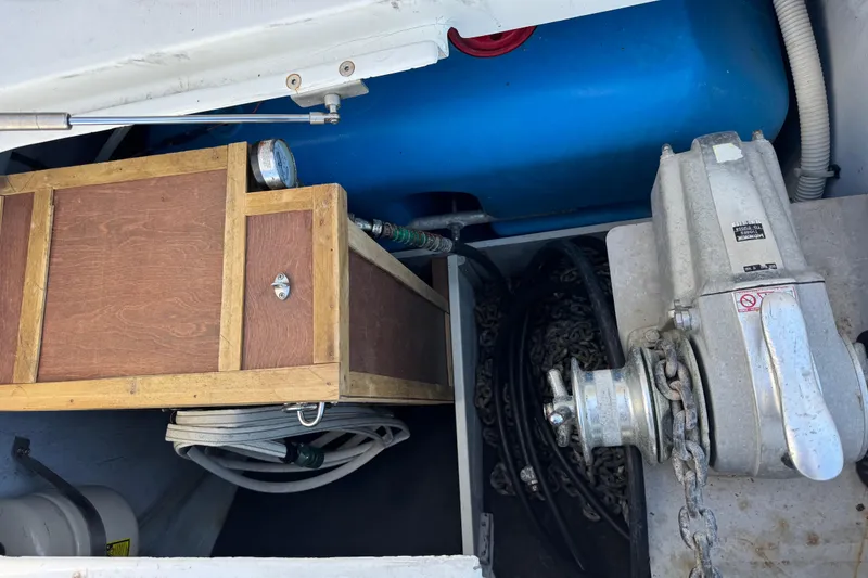 Slide: The Image of Storage compartment of a 2006 Lagoon 380 catamaran with equipment and chains. - 26