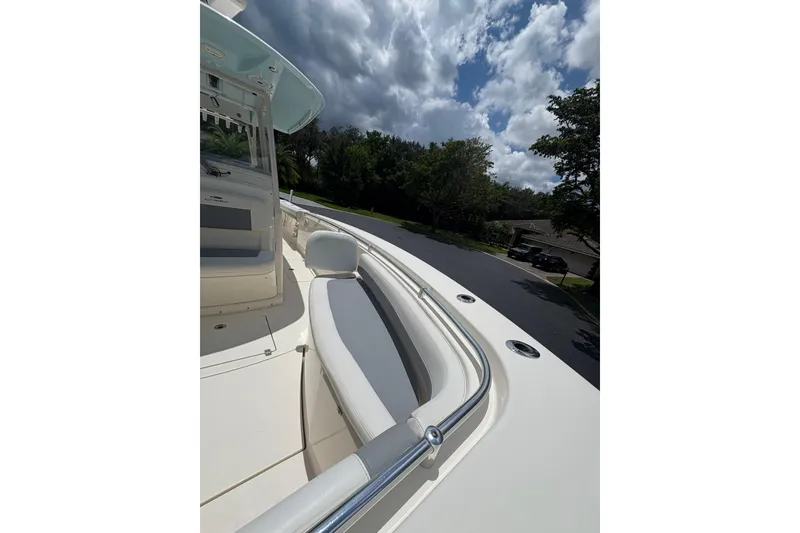Slide: The Image of 2018 Cobia 301 Center Console boat with sleek seating and stainless steel railings. - 22