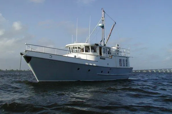 The Image of 1990 Nordhavn 46 yacht on open water under clear sky. - 0