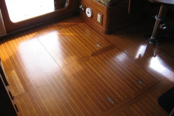 Slide: The Image of Polished wooden floor inside a 1990 Nordhavn 46 yacht, showcasing elegant craftsmanship. - 18