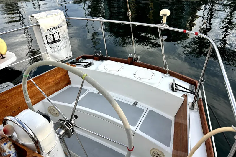 Slide: The Image of Hinckley 38 sailboat cockpit, 1969 model, featuring a classic wooden and metal design. - 10