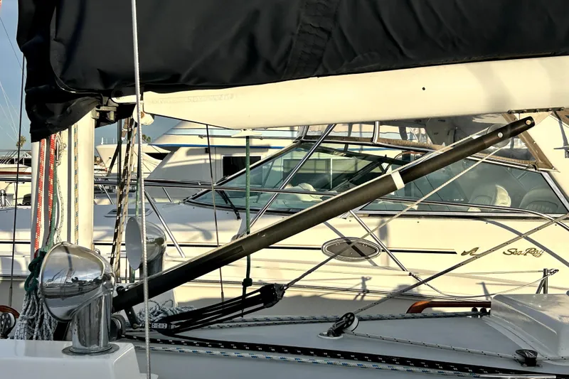 Slide: The Image of 1969 Hinckley 38 sailboat mast and rigging detail in marina setting. - 12