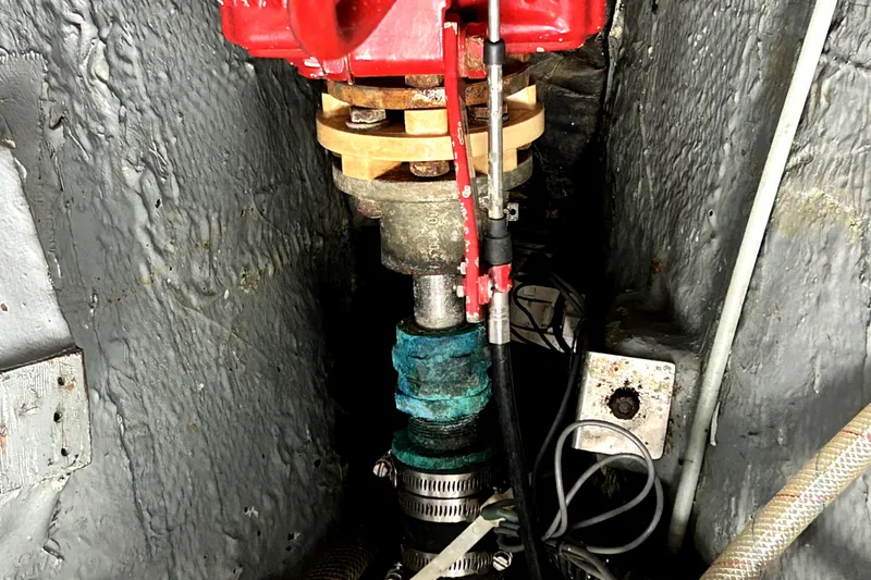 Slide: The Image of Engine compartment of a 1969 Hinckley 38 boat, showing mechanical components and wiring. - 34