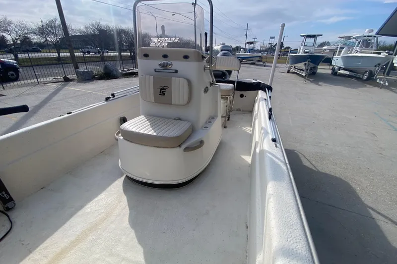 Slide: The Image of 2015 Carolina Skiff 20 JVX CC boat interior with console and seating. - 13