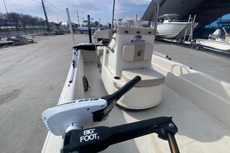 Slide: The Image of 2015 Carolina Skiff 20 JVX CC boat with Big Foot motor, docked outdoors. - 14