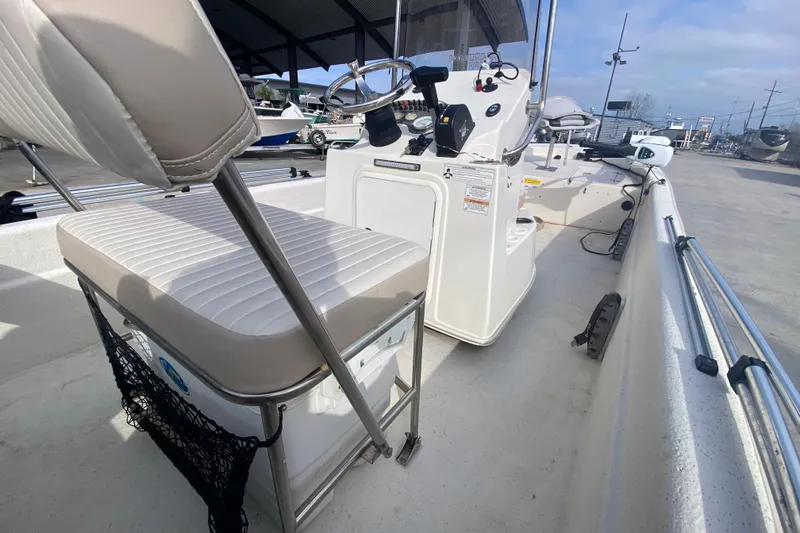 Slide: The Image of 2015 Carolina Skiff 20 JVX CC boat interior with steering console and seating. - 16